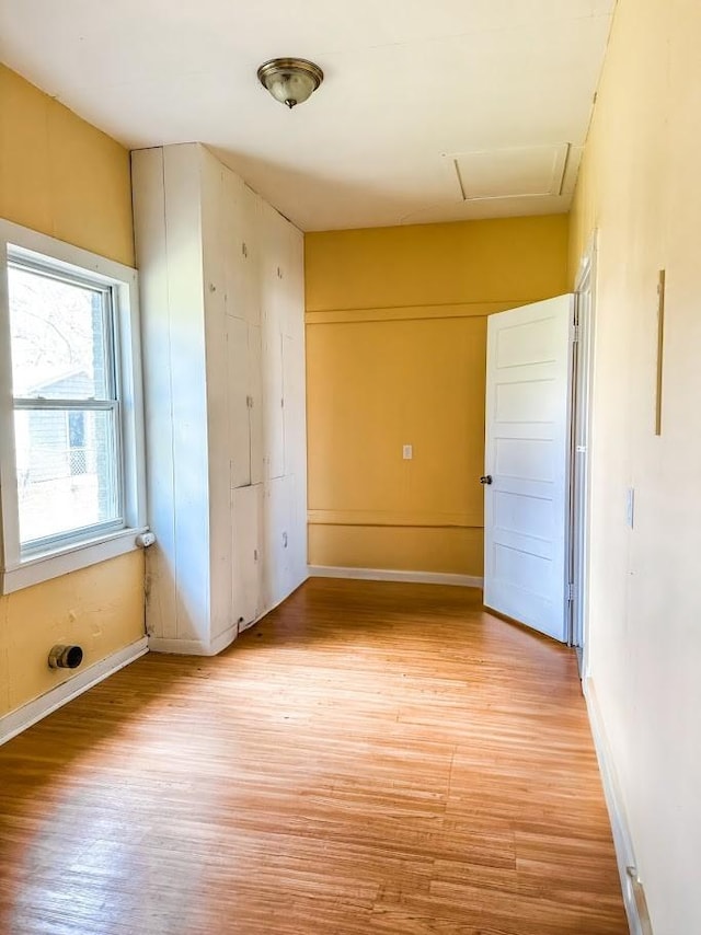 spare room with light hardwood / wood-style flooring