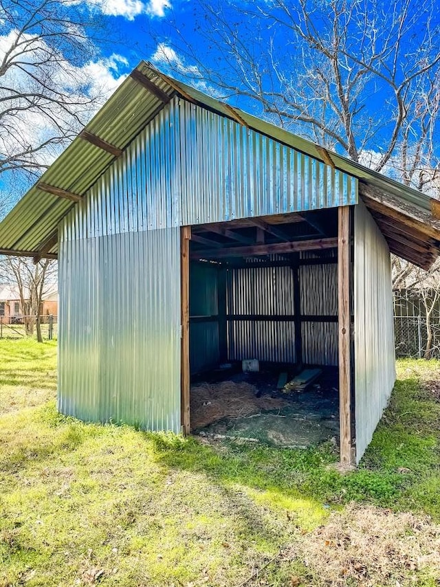 view of outdoor structure with a lawn