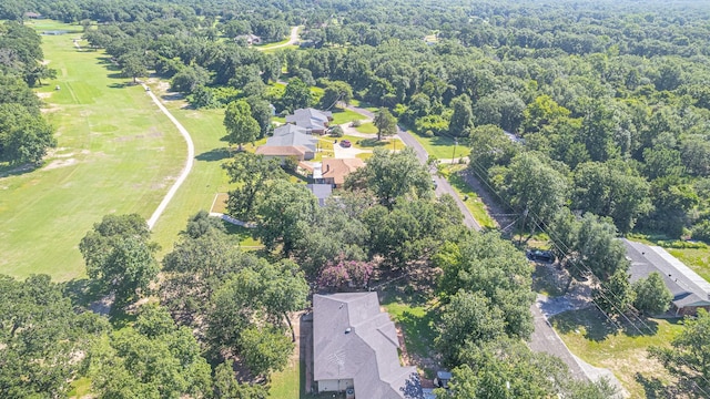 birds eye view of property with a forest view