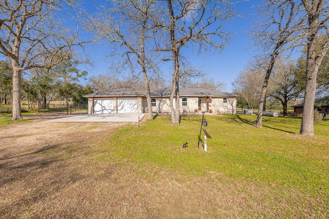 view of front facade with a front lawn, concrete driveway, and an attached garage