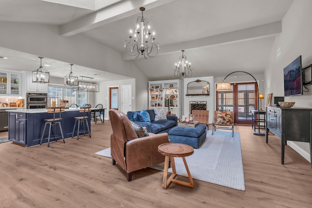 living room featuring vaulted ceiling with beams, a chandelier, and light wood-type flooring