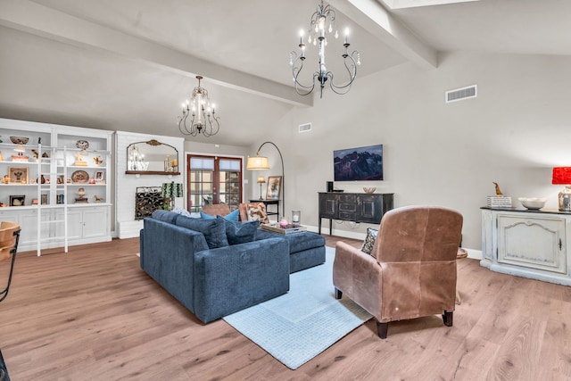 living room featuring vaulted ceiling with beams, light wood-type flooring, french doors, and a notable chandelier