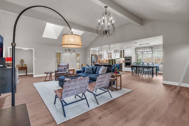 living room featuring beamed ceiling, high vaulted ceiling, a notable chandelier, and light wood-type flooring