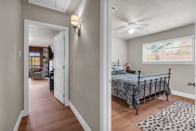 bedroom with wood-type flooring and a textured ceiling