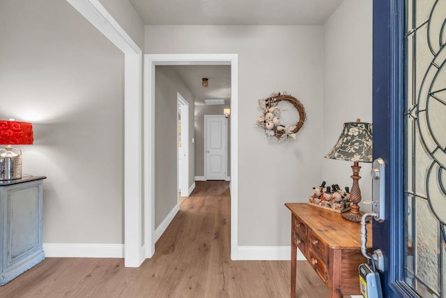 foyer entrance with light hardwood / wood-style floors