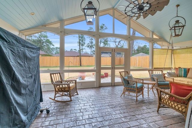 sunroom with vaulted ceiling and ceiling fan