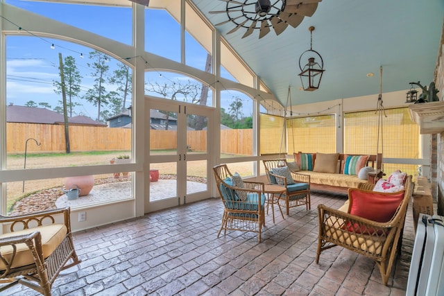 sunroom with ceiling fan