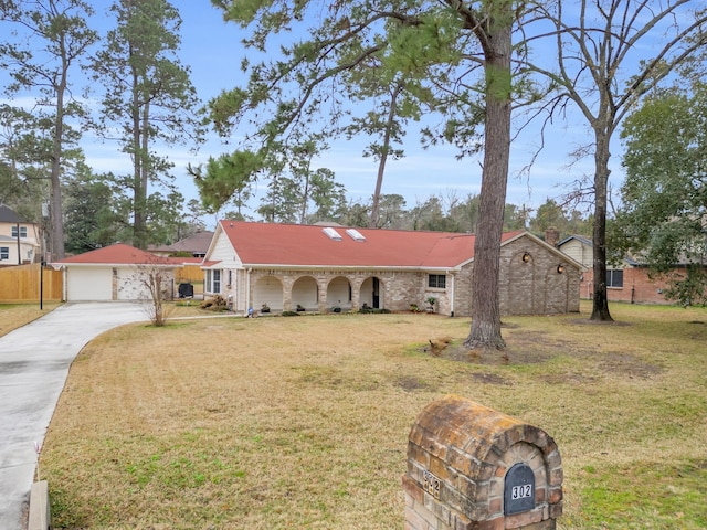 ranch-style home with a garage, an outdoor structure, and a front lawn