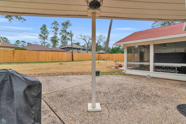 view of patio with a sunroom and grilling area