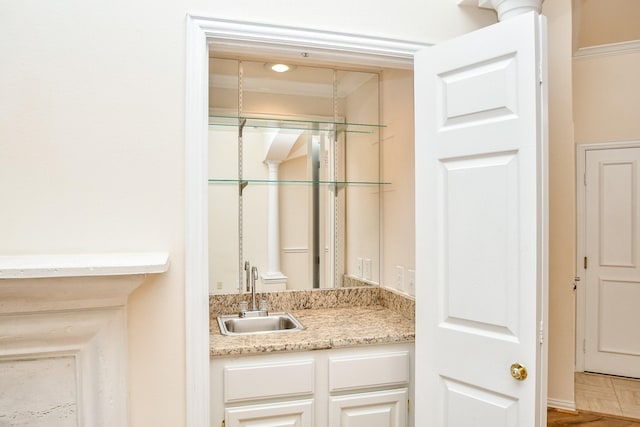 bathroom with vanity and hardwood / wood-style floors