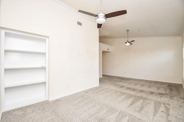 carpeted empty room featuring ceiling fan, visible vents, baseboards, and ornamental molding