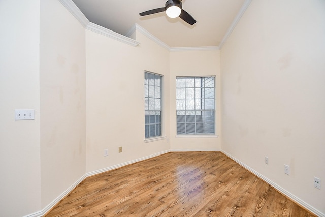 empty room with ceiling fan, baseboards, ornamental molding, and light wood-style floors