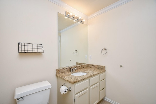 half bath featuring toilet, vanity, and ornamental molding
