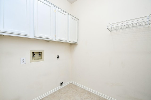 clothes washing area featuring cabinets, washer hookup, and hookup for an electric dryer