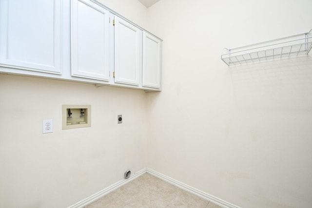 laundry area with cabinet space, washer hookup, baseboards, and electric dryer hookup