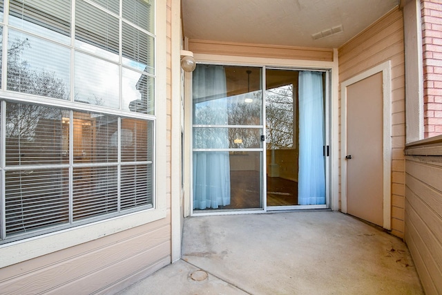 property entrance with visible vents