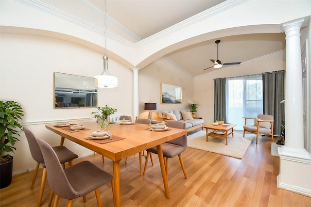 dining room with ceiling fan, light wood-type flooring, and ornate columns