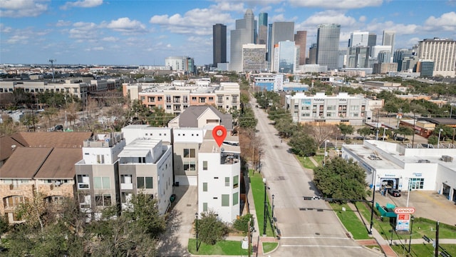 birds eye view of property with a view of city