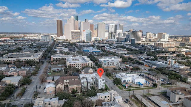 birds eye view of property featuring a city view