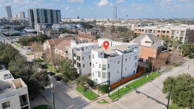 birds eye view of property with a city view