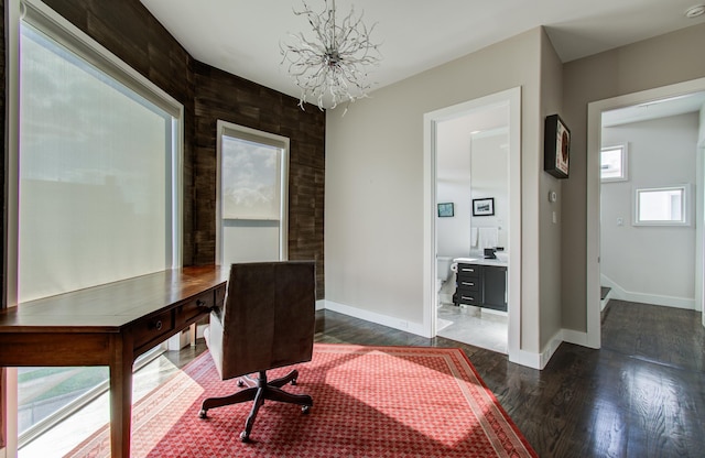 office with dark wood-style floors, a notable chandelier, and baseboards