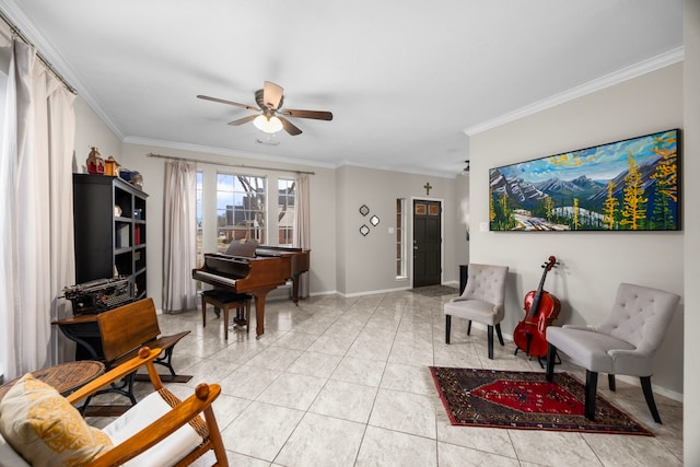 sitting room with light tile patterned floors, ornamental molding, and ceiling fan