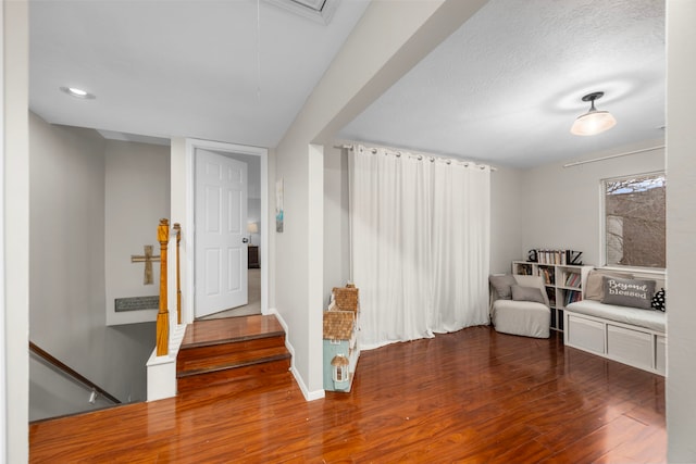 interior space with hardwood / wood-style floors and a textured ceiling