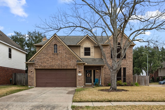 view of front facade with a garage and a front lawn