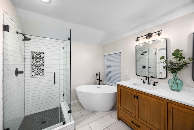 bathroom featuring vanity, shower with separate bathtub, and tile patterned flooring