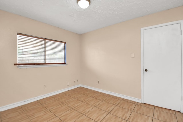 empty room with a textured ceiling