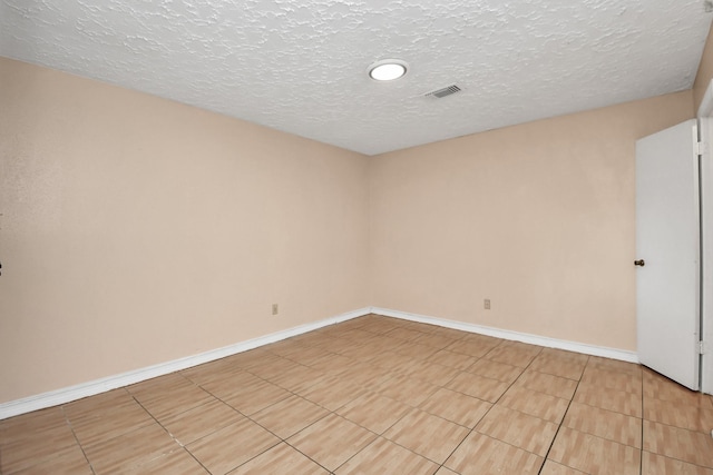 empty room with a textured ceiling