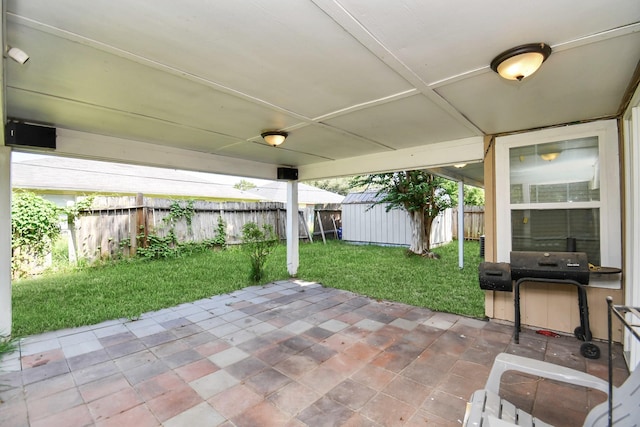 view of patio with a storage unit