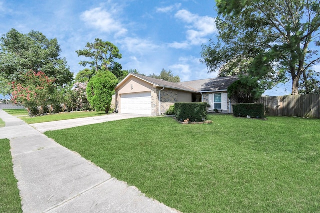 ranch-style home with a garage and a front yard