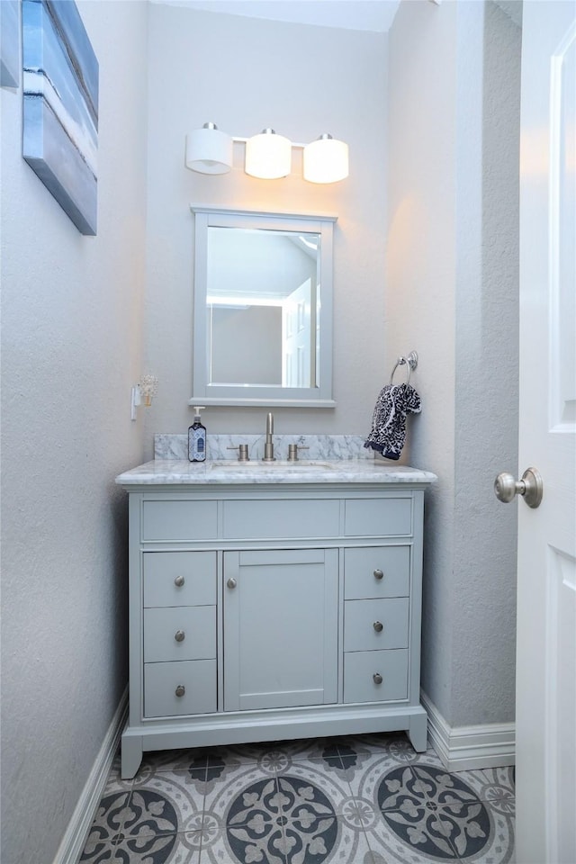 bathroom with vanity and tile patterned floors