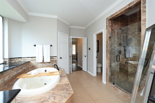 bathroom featuring tile patterned flooring, crown molding, shower with separate bathtub, and toilet