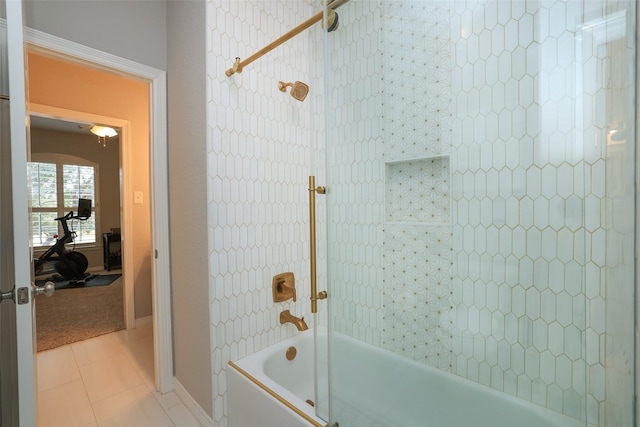 bathroom with tiled shower / bath and tile patterned floors