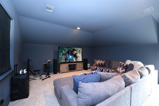 cinema featuring vaulted ceiling and carpet