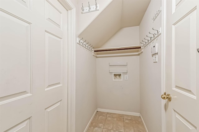 washroom featuring light tile patterned flooring and washer hookup