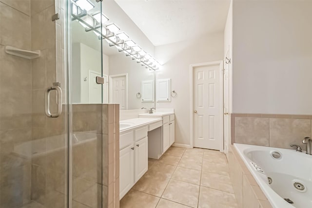 bathroom featuring tile patterned flooring, vanity, and plus walk in shower