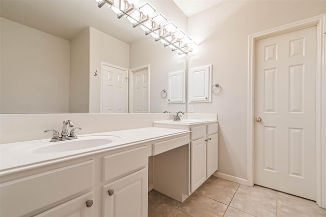 bathroom featuring tile patterned flooring and vanity