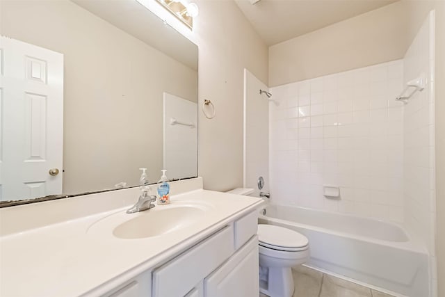 full bathroom with vanity, tiled shower / bath combo, tile patterned floors, and toilet