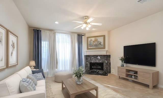 1408 S Friendswood Dr Unit 101, Friendswood, TX 77546 - living room featuring a ceiling fan, a premium fireplace, and recessed lighting