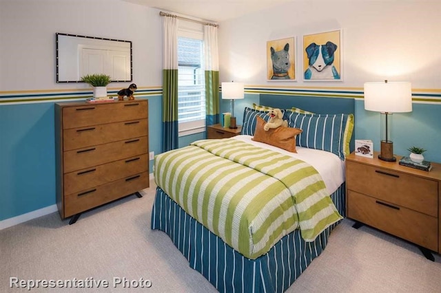 bedroom featuring light colored carpet