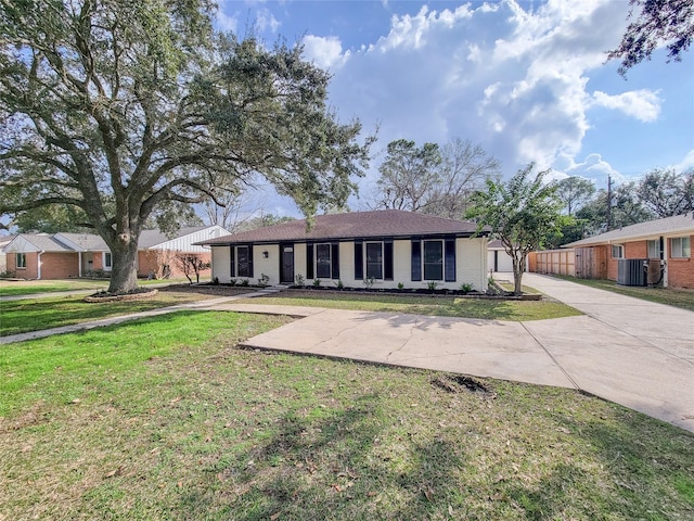 single story home with a garage and a front yard