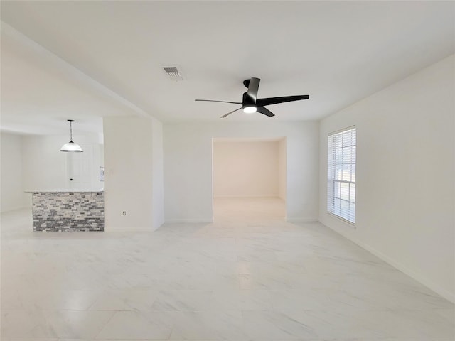 unfurnished room featuring ceiling fan