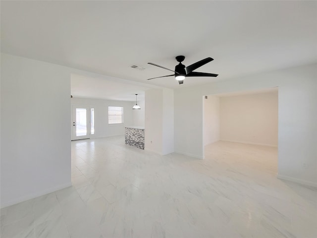 unfurnished room featuring ceiling fan