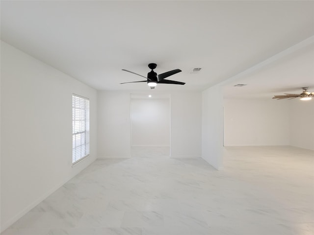 spare room featuring ceiling fan