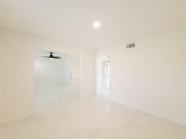 spare room with ceiling fan