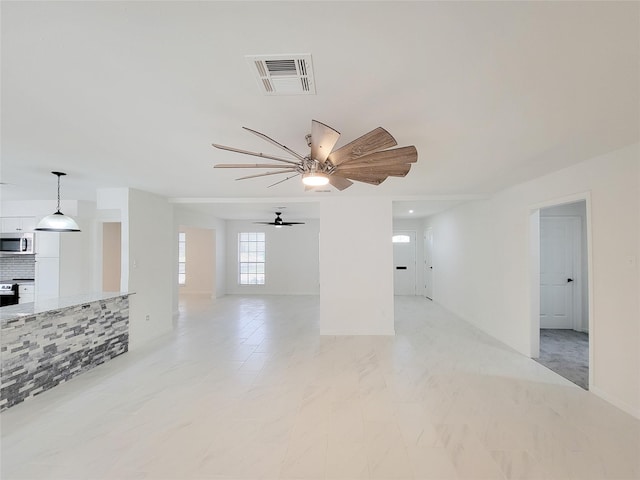 spare room with ceiling fan