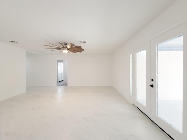 empty room with french doors and ceiling fan